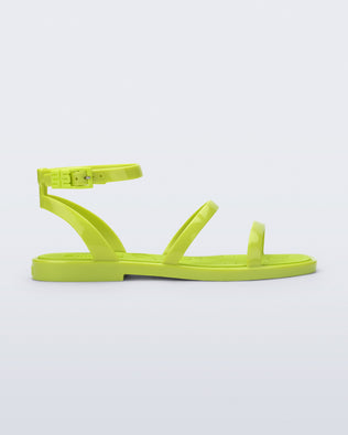 Side view of the Melissa heat neon green sandal on a light gray background
