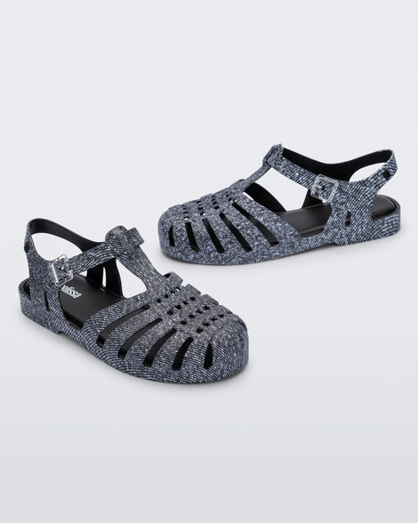 Angled view of a pair of black jean Possession sandals