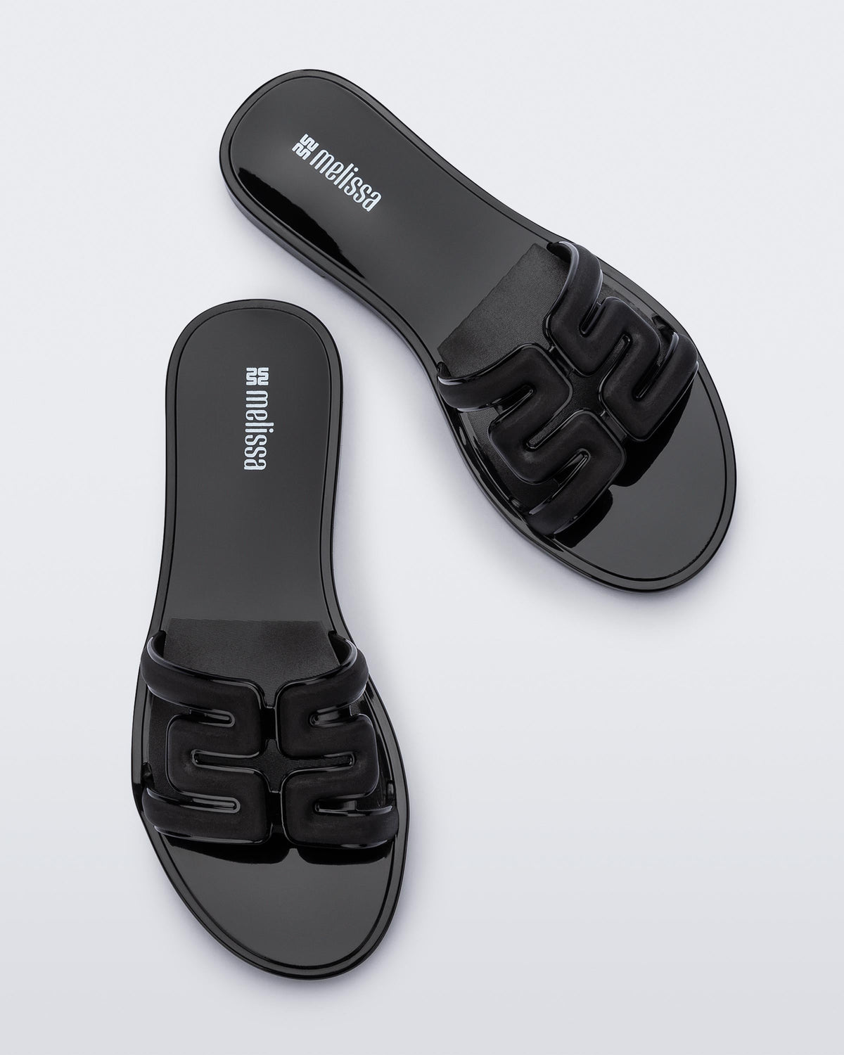 Top view of a pair of black M Slides.