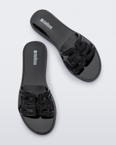 Top view of a pair of black M Slides.