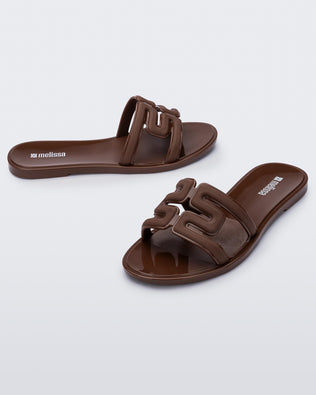 Product element, title M Slide in Brown
 price €49,00