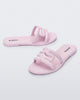 Angled view of a pair of light pink M Slides.