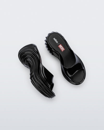 Top and side view of a pair of black Platforms + Diesel slides