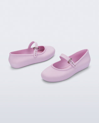 Back and side view of a pair of pink kids Soft ballerinas with strap and buckle