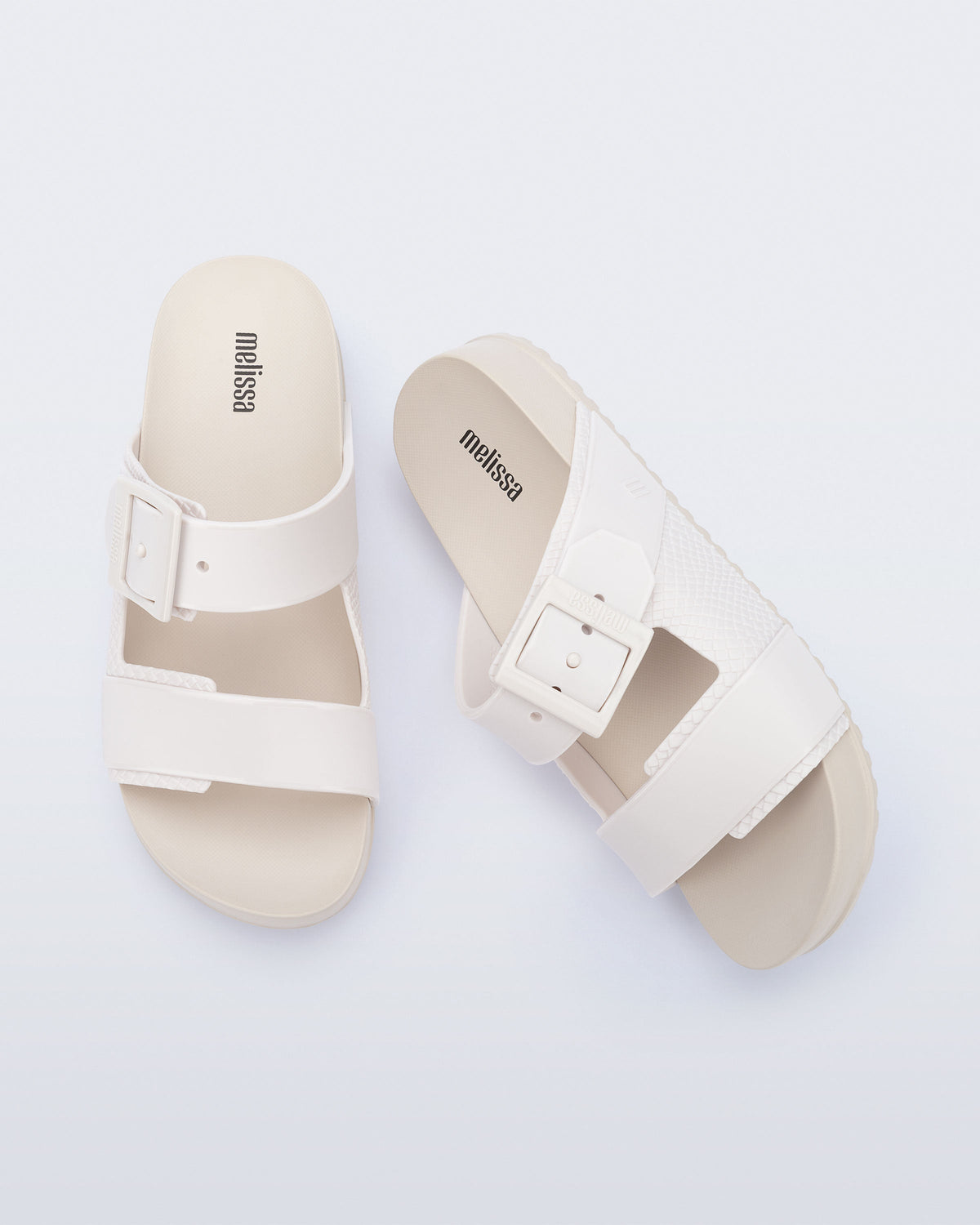 Top view of a pair of white Cozy Connection slides
