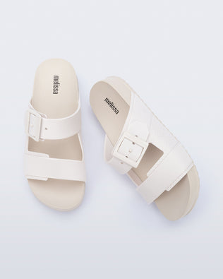 Top view of a pair of white Cozy Connection slides
