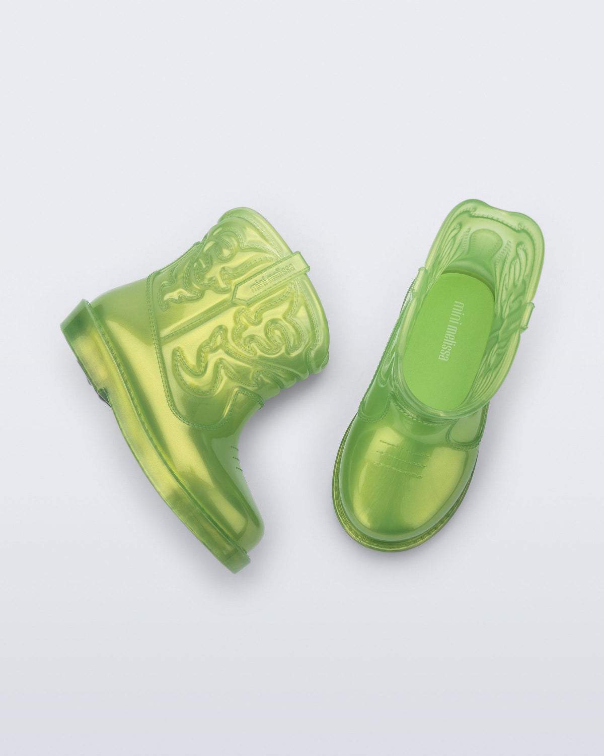 Top and side view of a pair of pearly green Texas baby boots