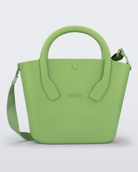 Back view of a green Free Big Bag with handles and a strap