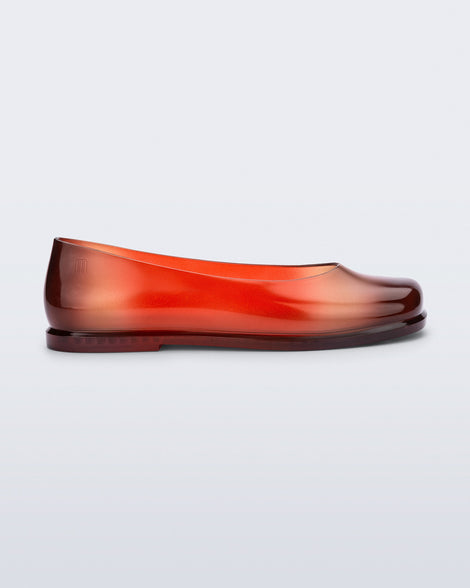Side view of a transparent red Ruby + Nodaleto flat