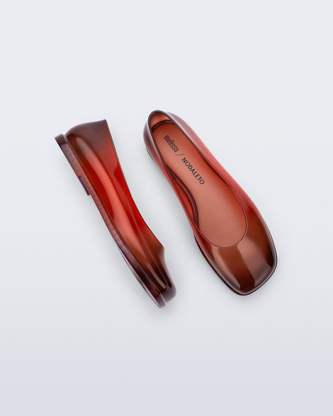 Top and side view of a pair of transparent red Ruby + Nodaleto flats