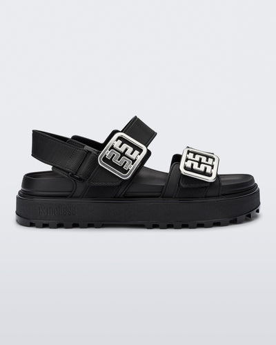 Side view of a black Towny sandal with straps and silver buckle