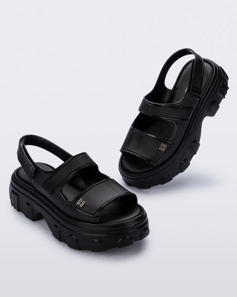 Angled view of a pair of black Ella Move platform sandals.