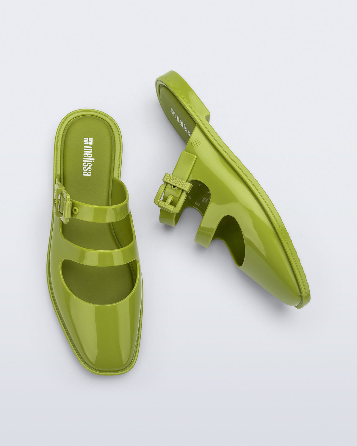 Side and top view of a pair of green Anastasia mule slides