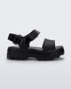 Side view of a Mini Melissa Kick Off platform sandal in black with adjustable velcro ankle strap.