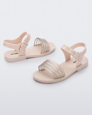 Angled view of a pair of beige Mar Wave kids sandals.