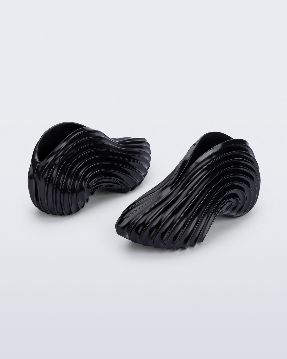 Back and angled view of a black Sneaker + Diesel