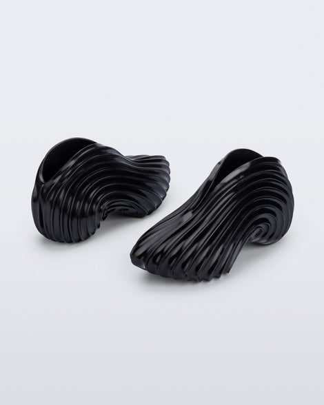 Back and angled view of a black Sneaker + Diesel