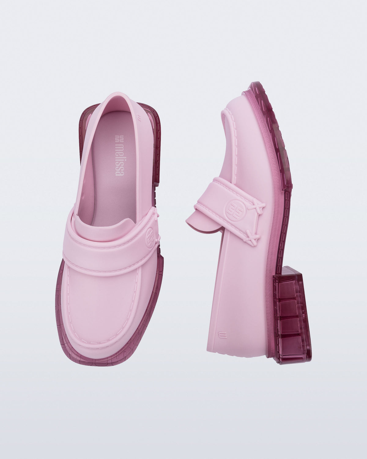 Top and side view of a pair of pink Spencer loafers with clear pink soles