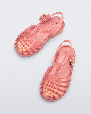 Top view of a pair of pearly pink Possession sandals