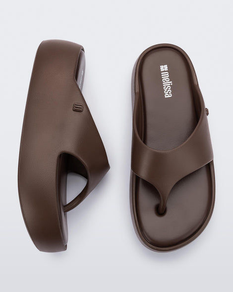 Side and top view of a pair of bronze Free Platform Thong sandal