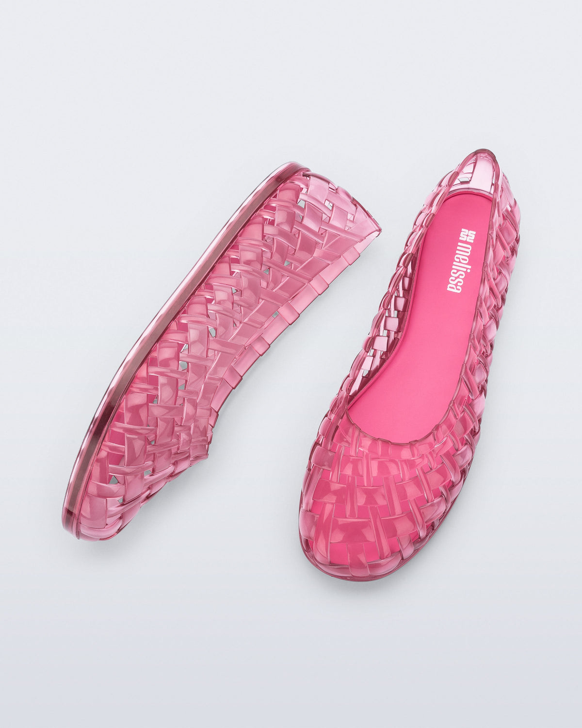 Top and side view of a pair of clear pink Possession Ballerina flats