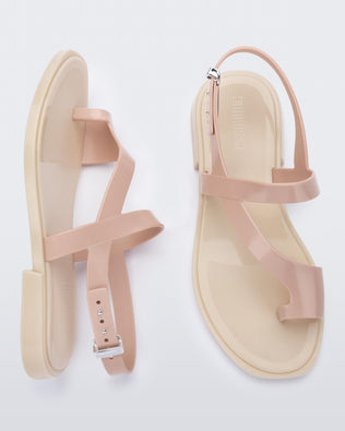 Top and side view of a pair of pink Cassie sandals.