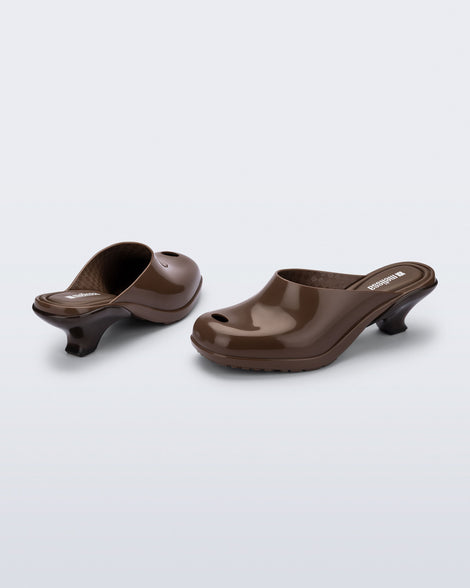 Back and angled view of a pair of brown Gaia kitten heels with peep toe