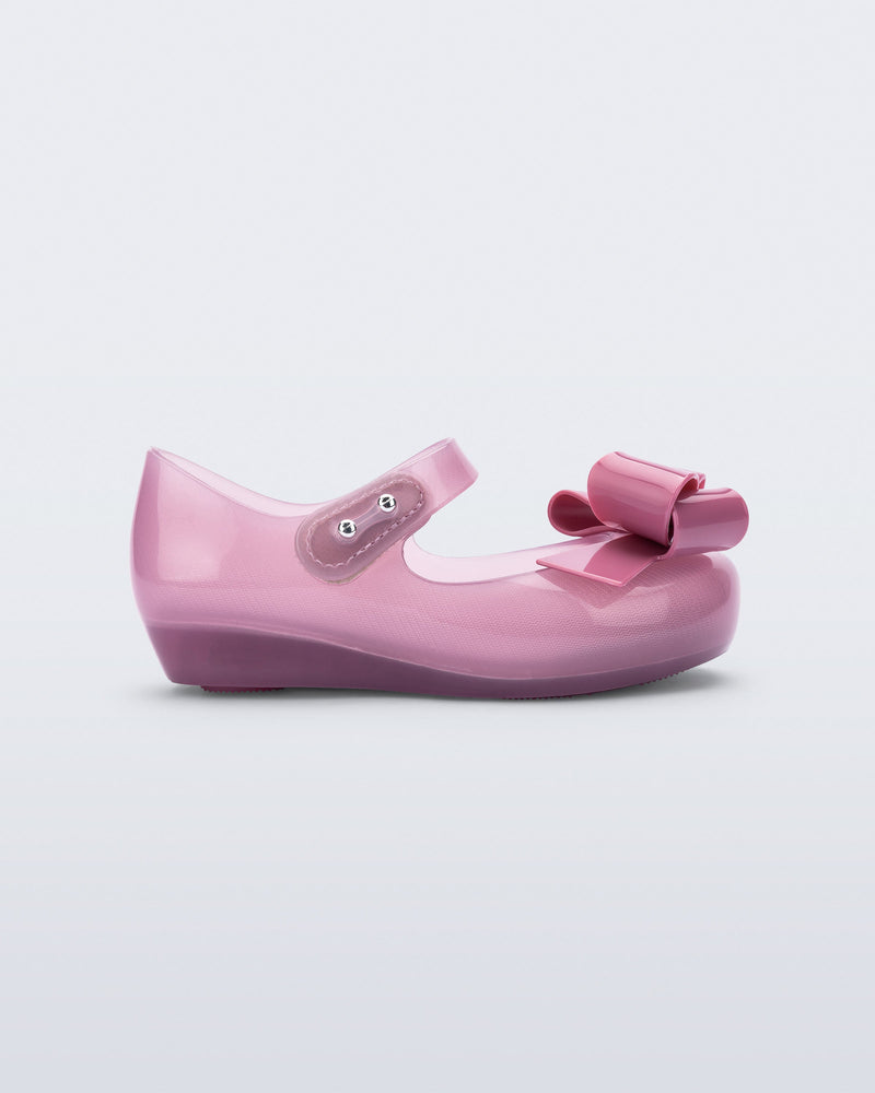 Side view of a lilac Ultragirl Classy baby ballerina with lilac bow.