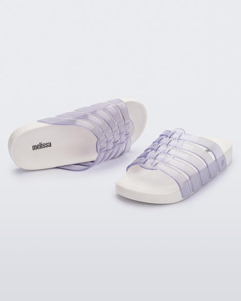 Top and angled view of a pair of clear Possession Slide with white sole