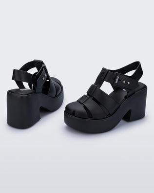 Back and angled view of a pair of matte black Lulu platform heel sandals