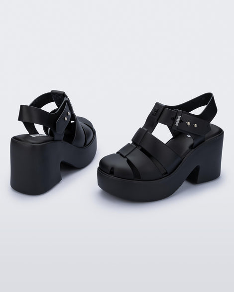 Back and angled view of a pair of matte black Lulu platform heel sandals