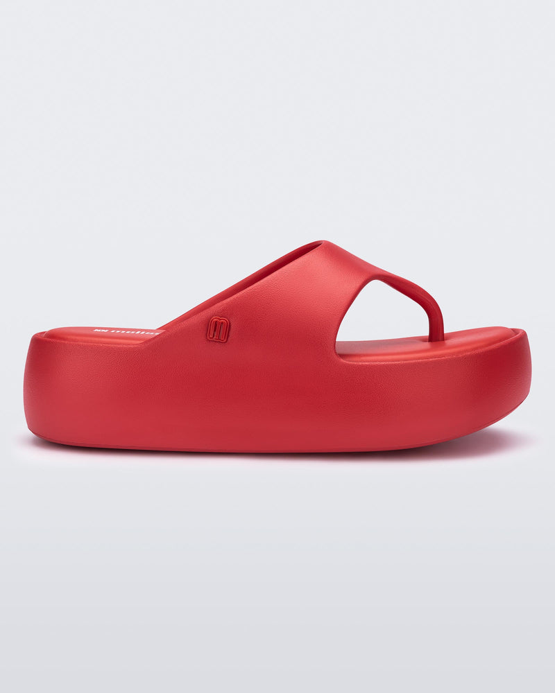Side view of a beige Free Platform Thong sandal