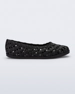 Side view of a black Possession Ballerina flat