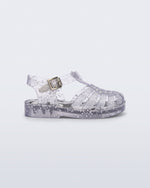 Side view of a clear Possession baby sandal with star glitter