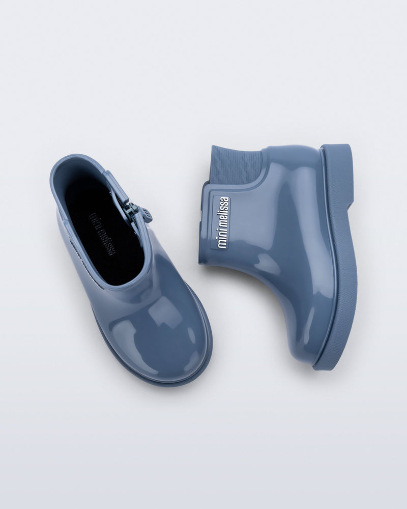 Top and side view of a pair of blue Chelsea II baby boots