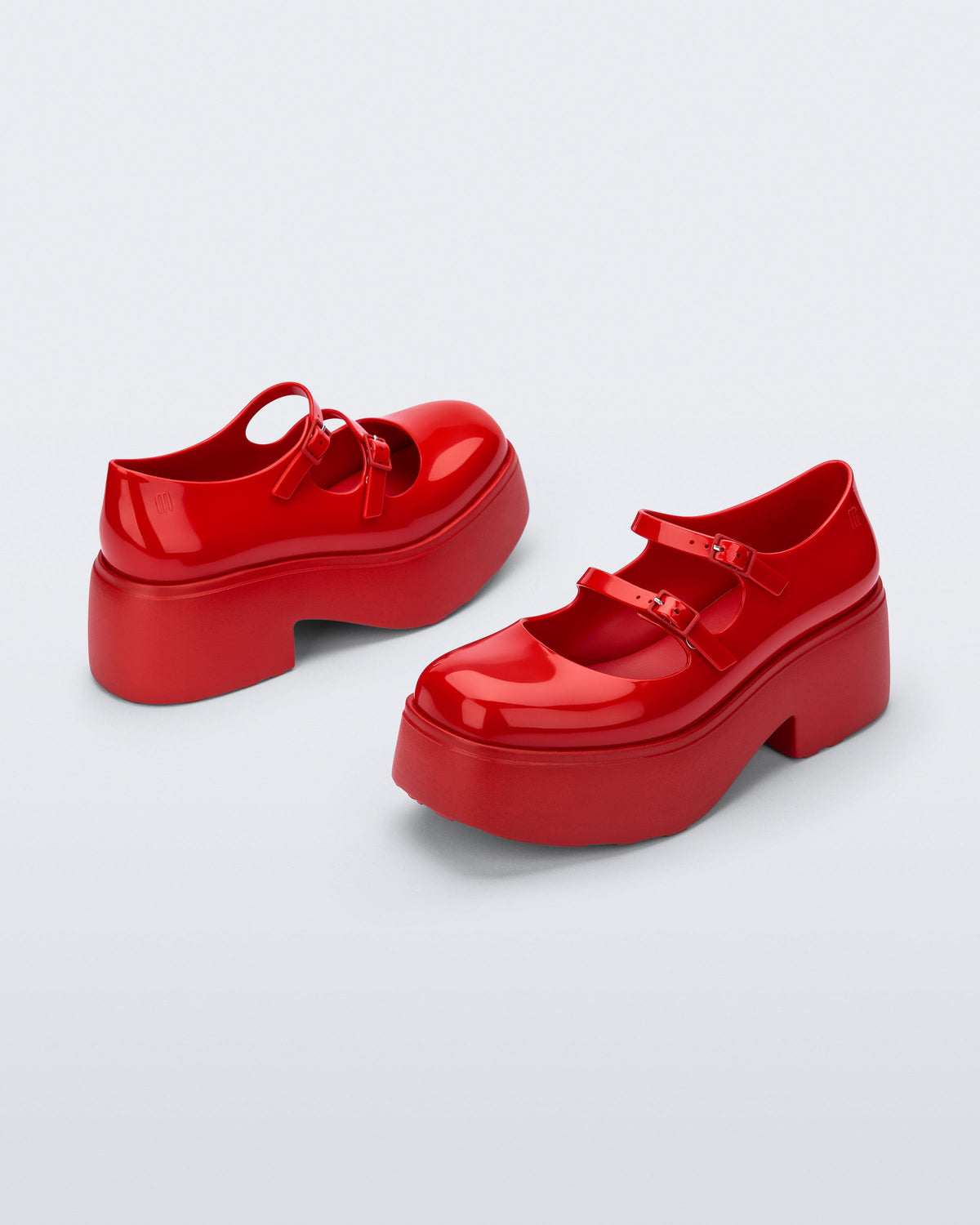 Back and front angled view of a pair of red Farah platform mary janes