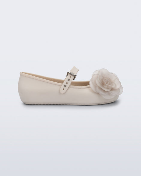 Side view of a beige Soft Ballerina Petals kids flat with flowers