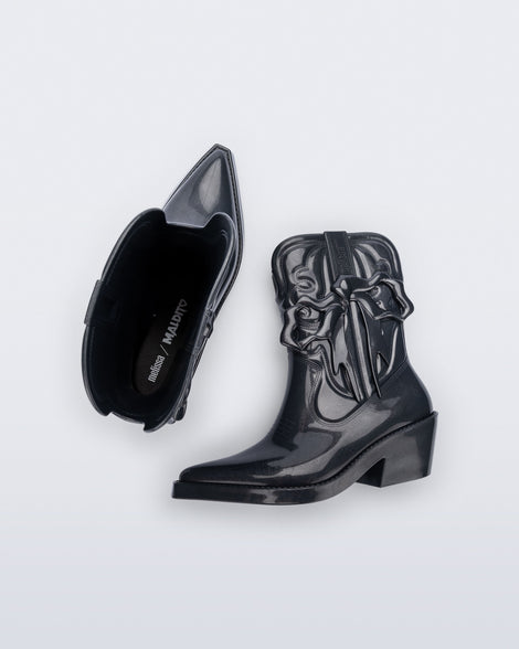 Top and side view of a pair of metallic grey Texas + Maldito boots