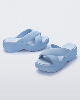 Side and angled view of a pair of blue Free Rise platform slide