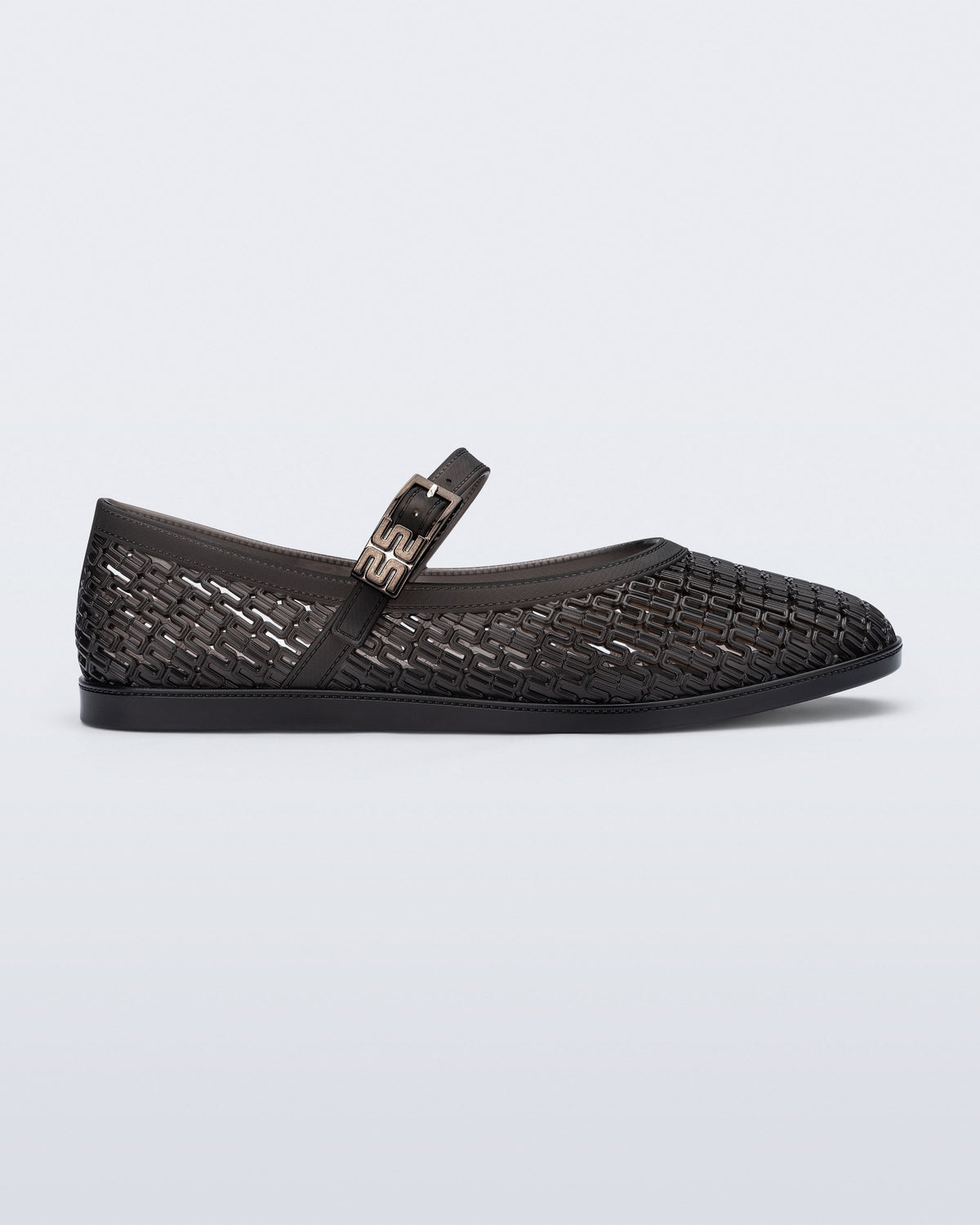Side view of a clear black Harper flat with strap