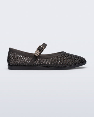 Side view of a clear black Harper flat with strap