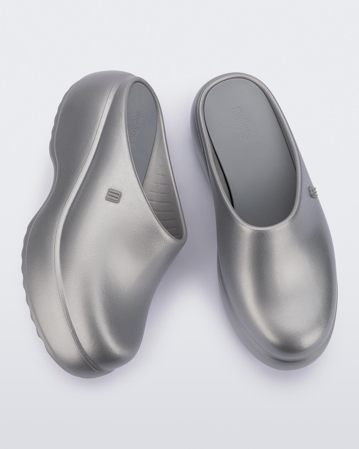 Side and top view of a pair of grey Free Clog Platforms