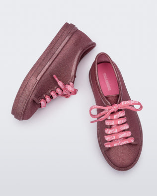 Top and side view of a pair of glitter pink Hip M Lover kids sneakers with laces.