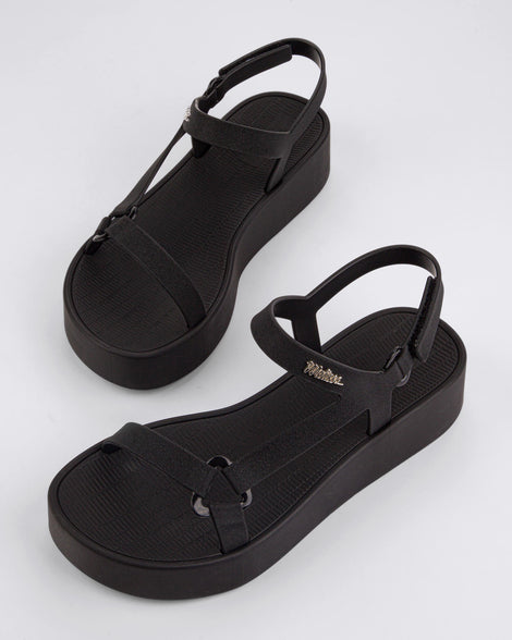 Top angled view of a pair of black Sun Downtown Platform sandals