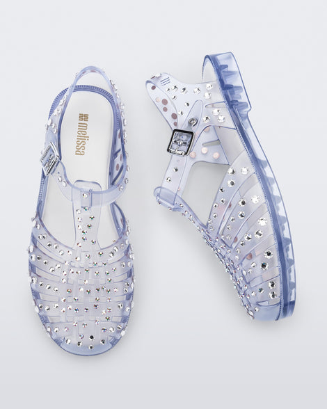 Top and side view of a pair of clear Possession Crystals sandals