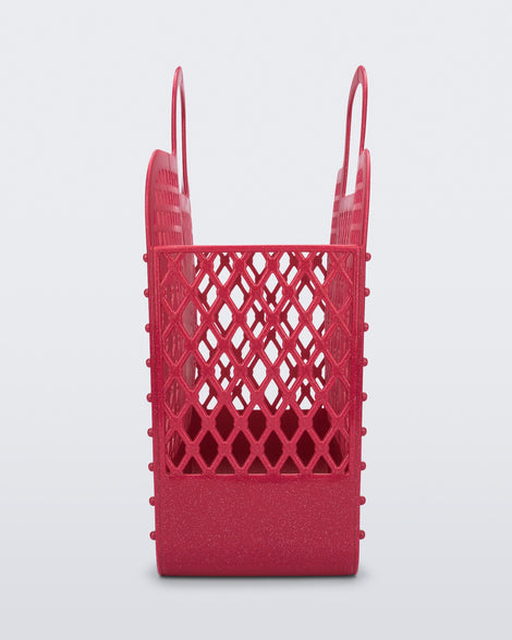 Side view of the glitter pink Bag + Bimba y Lola
