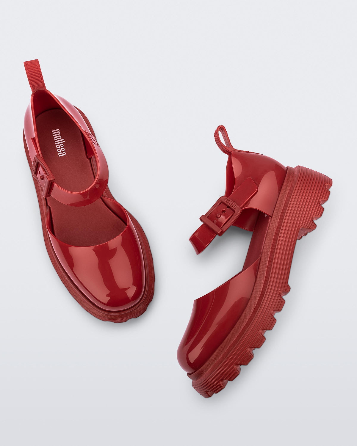 Side and top view of a pair red Ellie ankle strap loafers