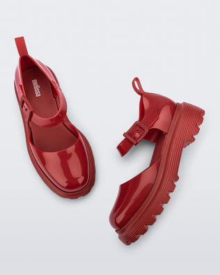 Side and top view of a pair red Ellie ankle strap loafers