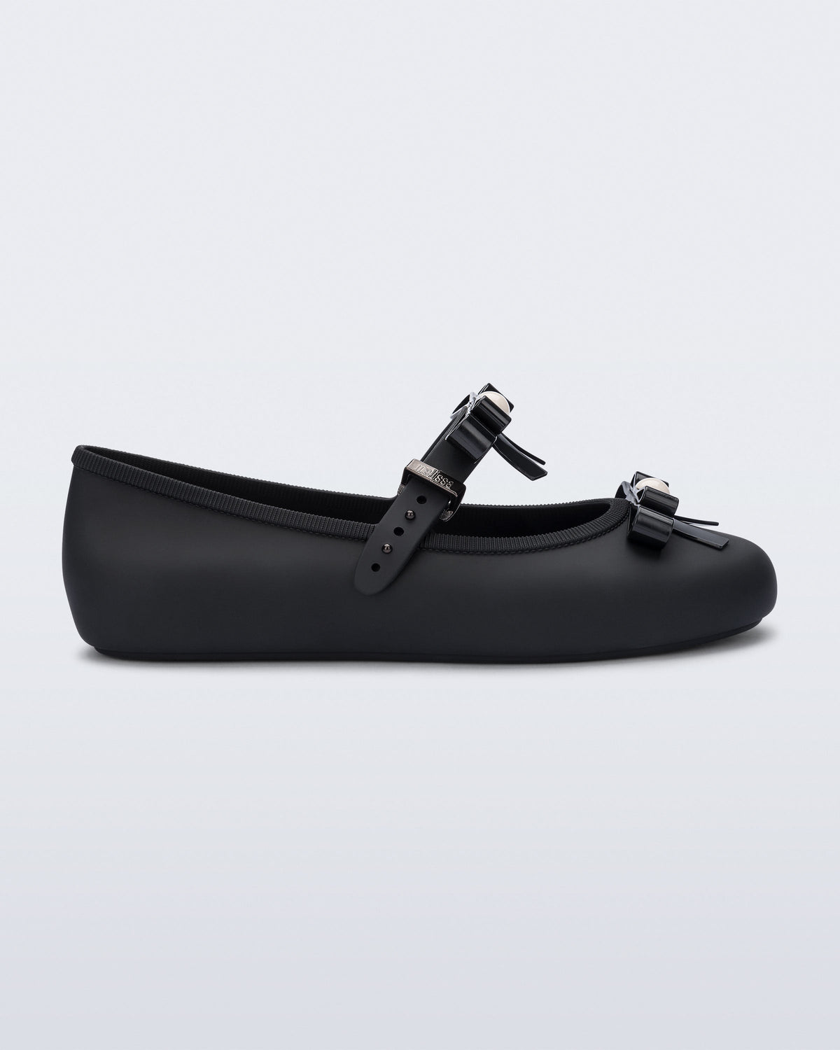 Side view of a black Soft Ballerina Bow with bows and a pearl in the center of each bow