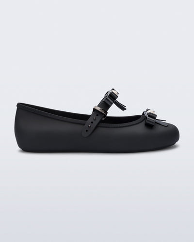 Side view of a black Soft Ballerina Bow with bows and a pearl in the center of each bow